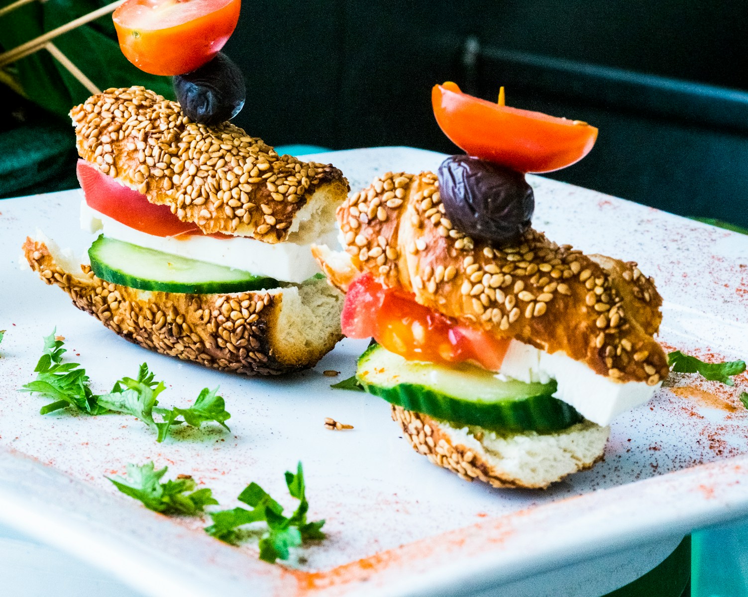 bread, sliced cucumber, and tomatoes on plate